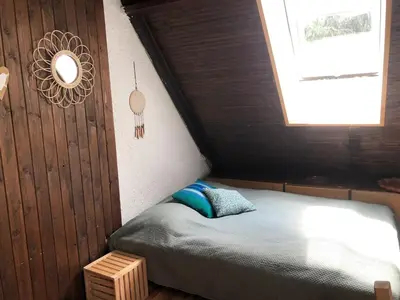 a small bed in a room with a window at Prague house in Green Oasis 10min to the downtown in Prague