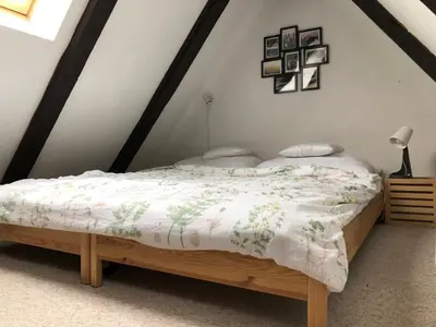 a bedroom with a bed in a attic at Prague house in Green Oasis 10min to the downtown in Prague