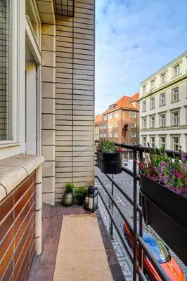 a balcony with potted plants on a building at Modern & Elegance Suite Apartment Prague in Prague