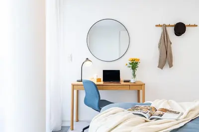 a bedroom with a desk and a chair and a mirror at Prague Days - Family Friendly Two-Bedroom Apartment with AC, Garage and Terrace in Holešovice in Prague