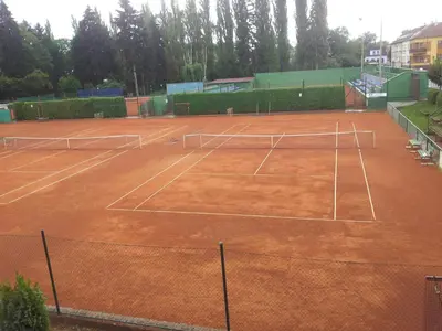a tennis court with two tennis rackets on it at Penzion Tenis in Poděbrady