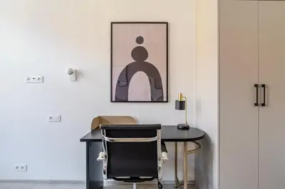 a dining room with a table and a chair at Blueground Nusle balcony nr Vyšehrad PRG-74 in Prague