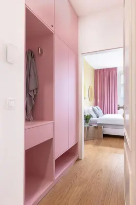 a pink room with a bed and a bedroom at Prague Center Studio in Prague