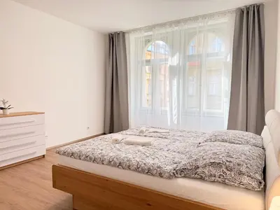a kitchen with stainless steel cabinets and a stove at Apartment Old Town Square in Prague