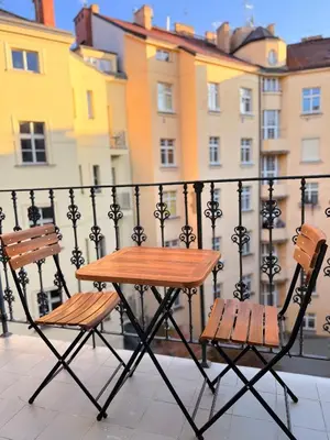 a living room with a flat screen tv on a cabinet at Apartment Old Town Square in Prague