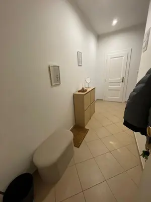 a white bathroom with a toilet and a sink at Apartmá ve Středu Prahy in Prague