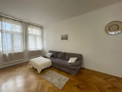 a living room with a couch and a table at Apartmá ve Středu Prahy in Prague