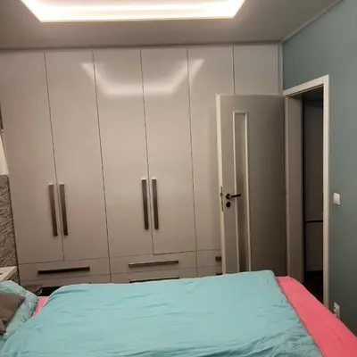 a bedroom with white cabinets and a bed at Big apartment in quiet location close to the center -ideal for families with kids in Prague