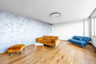 a living room with two chairs and a couch at Urban Oasis Stodůlky in Prague