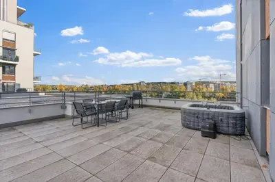 a view of the river from the balcony of a building at Terrace Royale in Prague