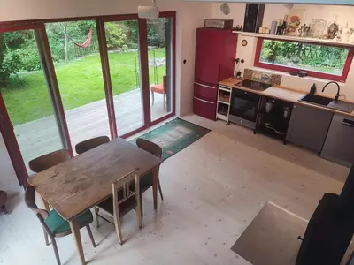 a kitchen with a table and chairs in a room at Romantický domek Slapy