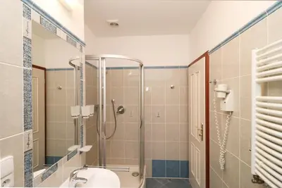 a bathroom with a shower and a toilet at Prague Mystique Apartment in Prague