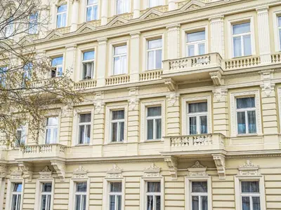 a large yellow building with windows and balconies at Apartment Washington-5 by Interhome in Prague