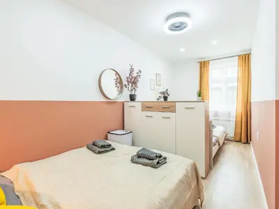 a bedroom with two beds and a mirror at Apartment Washington-4 by Interhome in Prague