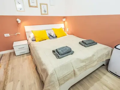 a bedroom with a bed with two pillows on it at Apartment Washington-4 by Interhome in Prague