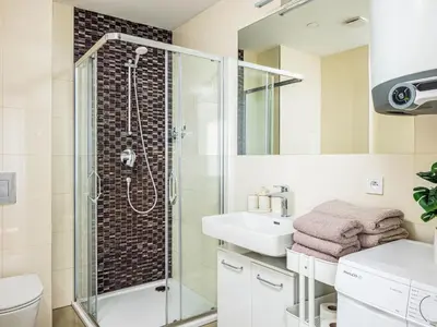 a bathroom with a shower and a sink at Apartment Washington-4 by Interhome in Prague