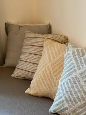 three pillows sitting on top of a bed at Urban Nest On Tyrsova 7 - Near IP Pavlova Metro in Prague