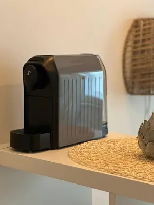 a toaster sitting on top of a table at Urban Nest On Tyrsova 7 - Near IP Pavlova Metro in Prague