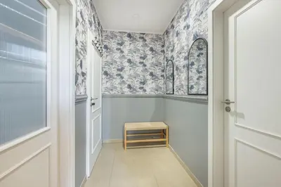 a small hallway with a door and a stool at HOMELY I Central 52m2 APT I ELEVATOR I Self Check-In in Prague