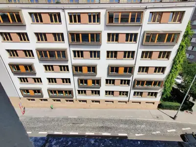 an apartment building with windows on the side of it at Zizkov Stay - Near City Center in Prague