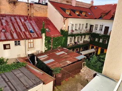 an overhead view of a group of buildings with roofs at Zizkov Stay - Near City Center in Prague