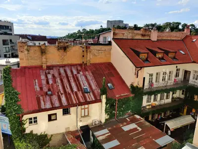 an overhead view of an old building with a red roof at Zizkov Stay - Near City Center in Prague