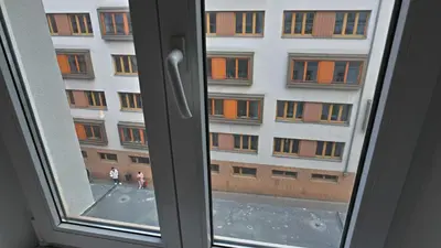 an open window with a view of a building at Zizkov Stay - Near City Center in Prague