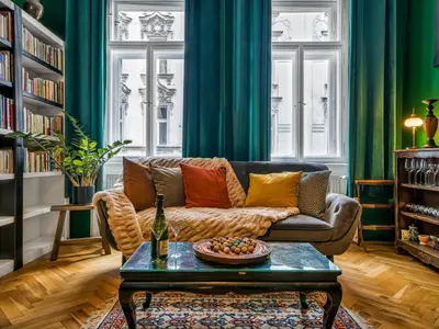 a living room with a couch and a table at Spacious 85 sqm Apartment for Monthly Stays in Prague