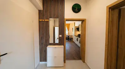 a room with a mirror on the wall at Samaya Apartment in Litoměřice