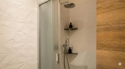 a shower with a glass door in a bathroom at Samaya Apartment in Litoměřice