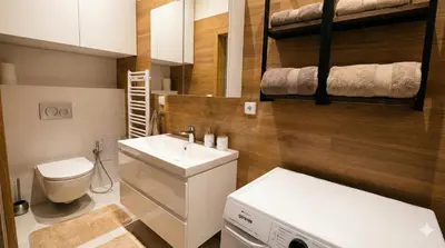 a small bathroom with a sink and a washing machine at Samaya Apartment in Litoměřice