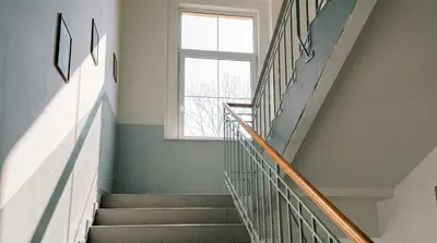 a stairway with a window and a stair case at Samaya Apartment in Litoměřice