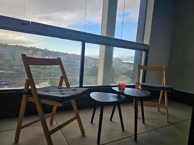 two chairs and a table in front of a window at Prague Centre Luxury Apartment & Parking in Prague