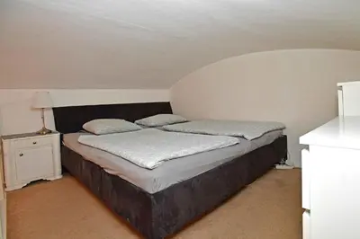 a large bed in a room with at Cozy Apartment in Letná in Prague