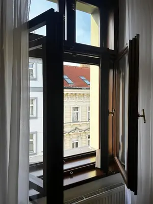 an open window with a view of a building at Vintage Apartment Old Prague Charm in Prague