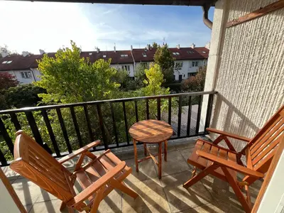 two chairs and a table on a balcony at Dům Solidarity Strašnice in Prague