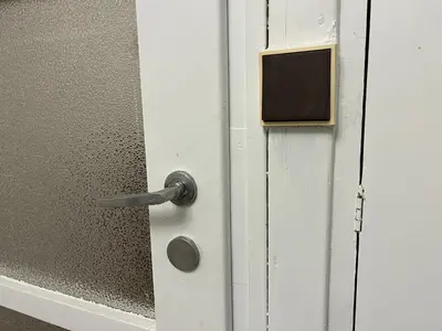 an open door with a metal door knob and a door at Dům Solidarity Strašnice in Prague