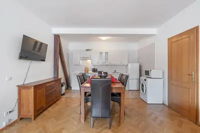 a kitchen and dining room with a table and chairs at Royal Prague Gallery in Prague