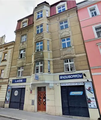 an old building on the corner of a street at Stela's Apartments - Vysehrad in Prague