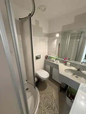 a bathroom with a toilet and a sink at Ethereal Haven 1 in Prague