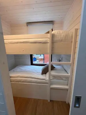 a bunk bed in a tiny house at Houseboat Rosie in Prague