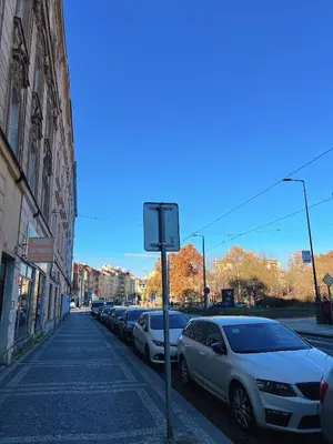 a row of cars parked on the side of a street at Phuong'Nest Modern Apartment near Old Town in Prague