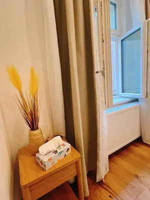 a small bedroom with a bed and a window at Phuong'Nest Modern Apartment near Old Town in Prague