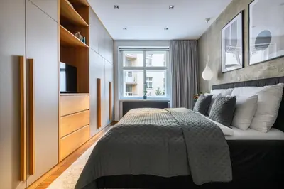 a bedroom with a large bed and a window at Stylish Apartment in Prague's Historic Centre in Prague