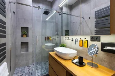 a bathroom with a sink and a shower at Stylish Apartment in Prague's Historic Centre in Prague