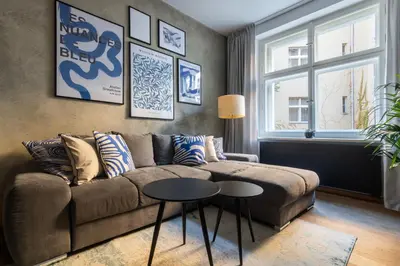 a living room with a couch and a table at Stylish Apartment in Prague's Historic Centre in Prague