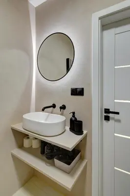 a bathroom with a sink and a mirror at CityMood Prague Apartment in Prague