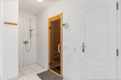 two exercise bikes in a room with a tile floor at Black Dragon Haven Luxury Villa with Pool, Sauna & Jacuzzi in Prague