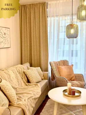 a living room with a couch and a table at My Sweet Home - Zakšínská - Prague in Prague