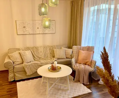 a living room with a couch and a table at My Sweet Home - Zakšínská - Prague in Prague